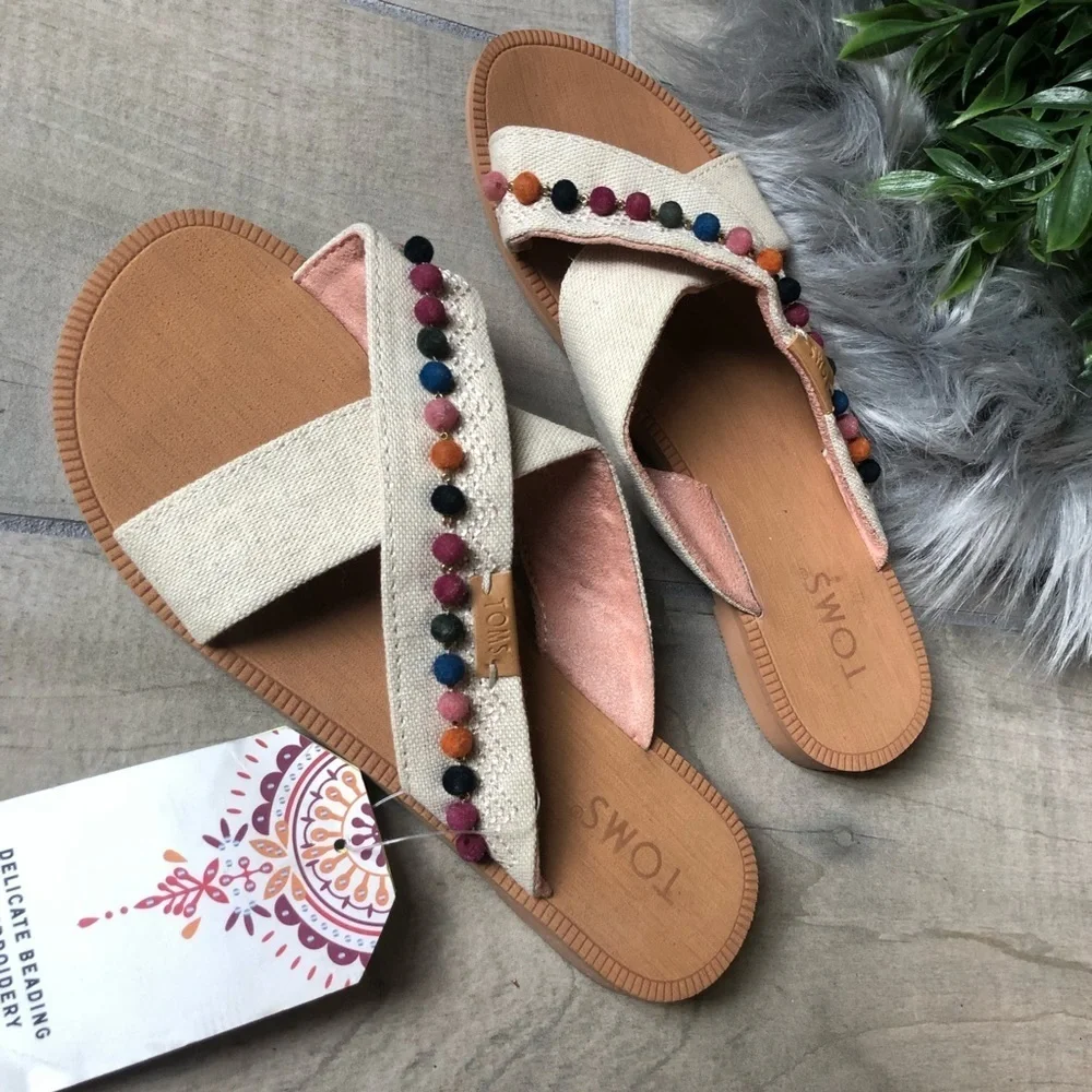 NWT! Tom’s kids’ bohemian Pom Pom sandals. Size 2